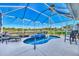 Enjoy this refreshing kidney-shaped pool and spa at 4245 Whispering Oaks Dr, North Port, FL 34287