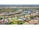 Aerial view of community with pool and lake at 4334 Lenox Blvd, Venice, FL 34293