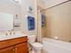 Bathroom with tub, single vanity, and blue towels at 4334 Lenox Blvd, Venice, FL 34293