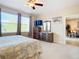 Spacious bedroom with a dresser and large window at 4334 Lenox Blvd, Venice, FL 34293
