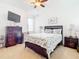 Bedroom with a queen-size bed, dresser and window at 4334 Lenox Blvd, Venice, FL 34293