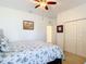 Bedroom with a full-size bed and double door closet at 4334 Lenox Blvd, Venice, FL 34293