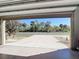 View from garage into backyard with open space at 4334 Lenox Blvd, Venice, FL 34293