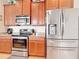 Modern kitchen with stainless steel appliances and granite countertops at 4334 Lenox Blvd, Venice, FL 34293