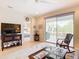 Living area with TV, access to patio and main bedroom at 4334 Lenox Blvd, Venice, FL 34293