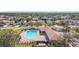 Community pool with lounge chairs and cabana at 4334 Lenox Blvd, Venice, FL 34293