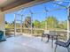 Spacious screened patio with seating and tranquil view at 4334 Lenox Blvd, Venice, FL 34293
