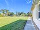 Landscaped yard with a walkway leading to the house at 4334 Lenox Blvd, Venice, FL 34293
