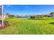 Expansive backyard offers stunning views of the tranquil community lake at 4980 Whispering Oaks Dr, North Port, FL 34287