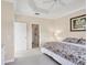 Comfortable bedroom with tray ceilings and a calming view at 4980 Whispering Oaks Dr, North Port, FL 34287