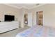 Bright bedroom with built-in shelving and access to a shared bathroom at 4980 Whispering Oaks Dr, North Port, FL 34287