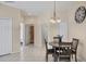 Charming dining area with neutral tones and tiled flooring at 4980 Whispering Oaks Dr, North Port, FL 34287