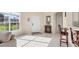 Bright entryway featuring tile flooring, a large window, and a welcoming interior at 4980 Whispering Oaks Dr, North Port, FL 34287