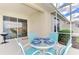 Cozy screened-in patio with outdoor dining set at 4980 Whispering Oaks Dr, North Port, FL 34287