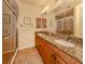 Elegant bathroom with dual sinks, granite countertops, and a large walk-in shower at 500 San Lino Cir # 521, Venice, FL 34292