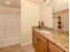 Clean bathroom with granite countertop, single sink, and tub shower combo at 500 San Lino Cir # 521, Venice, FL 34292