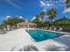 Inviting community pool area with plenty of lounge chairs at 500 San Lino Cir # 521, Venice, FL 34292