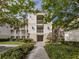 Building entrance with walkway and lush landscaping at 500 San Lino Cir # 521, Venice, FL 34292