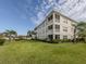 Building exterior showcasing water view and landscaping at 500 San Lino Cir # 521, Venice, FL 34292