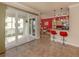 Modern kitchen with red accents and breakfast bar at 500 San Lino Cir # 521, Venice, FL 34292