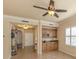 Wet bar with wood cabinetry, granite countertop, and wine rack at 500 San Lino Cir # 521, Venice, FL 34292