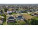 Overhead view showcasing the property's pool and patio, with a lovely view of the neighborhood at 52 Fairway Rd, Rotonda West, FL 33947