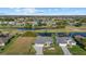 This aerial view displays the property's prime location near the water with picturesque community views at 52 Fairway Rd, Rotonda West, FL 33947