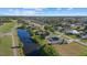 Aerial view of the home showcasing its location within a lush community with nearby waterways at 52 Fairway Rd, Rotonda West, FL 33947