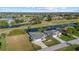 Aerial view of a home situated on a tranquil canal, near a golf course at 52 Fairway Rd, Rotonda West, FL 33947