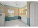 Bathroom with neutral walls, tiled floors, vanity area, and walk-in shower at 52 Fairway Rd, Rotonda West, FL 33947