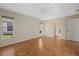 Bedroom with wood floors and door to bath at 52 Fairway Rd, Rotonda West, FL 33947