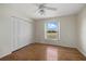 Bedroom with wood floors, window with a view, and closet at 52 Fairway Rd, Rotonda West, FL 33947