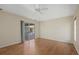 Bedroom features hardwood floors, a sliding glass door to the patio, and lots of light at 52 Fairway Rd, Rotonda West, FL 33947