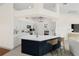 Bright kitchen featuring an island with seating and pendant lighting, plus modern appliances and ample counter space at 52 Fairway Rd, Rotonda West, FL 33947