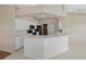 Kitchen boasts stainless steel appliances and a breakfast bar at 52 Fairway Rd, Rotonda West, FL 33947
