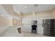 Bright kitchen boasts stainless steel appliances, white cabinetry, and an open layout at 52 Fairway Rd, Rotonda West, FL 33947