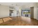 Spacious living room with hardwood floors and pool view at 52 Fairway Rd, Rotonda West, FL 33947