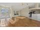 Bright living room featuring hardwood floors and open layout at 52 Fairway Rd, Rotonda West, FL 33947