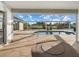 Inviting in-ground pool with screened enclosure providing a serene outdoor living space at 52 Fairway Rd, Rotonda West, FL 33947