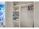 White closet with shelves and hanging rod at 537 Manatee Ct # 204, Venice, FL 34285