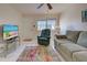 Living room with sofa, recliner, and rug at 537 Manatee Ct # 204, Venice, FL 34285