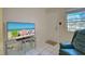Living room with recliner, TV, and ocean view at 537 Manatee Ct # 204, Venice, FL 34285