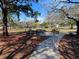 Picnic tables in a park with a walking path at 537 Manatee Ct # 204, Venice, FL 34285