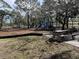Playground in a park setting with picnic tables at 537 Manatee Ct # 204, Venice, FL 34285