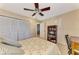 Bedroom with built-in shelving and ceiling fan at 927 Capri Isles Blvd # 5, Venice, FL 34292