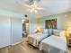 Guest bedroom with twin beds and access to a bathroom at 950 Tarpon Center Dr # 202, Venice, FL 34285