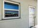 Condo building exterior with window and door detail at 950 Tarpon Center Dr # 202, Venice, FL 34285