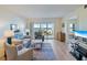 Living room with ocean view and comfy seating at 950 Tarpon Center Dr # 202, Venice, FL 34285