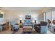 Living room with seating area and access to a balcony at 950 Tarpon Center Dr # 202, Venice, FL 34285