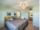 Main bedroom with a king-size bed and ensuite bathroom at 950 Tarpon Center Dr # 202, Venice, FL 34285